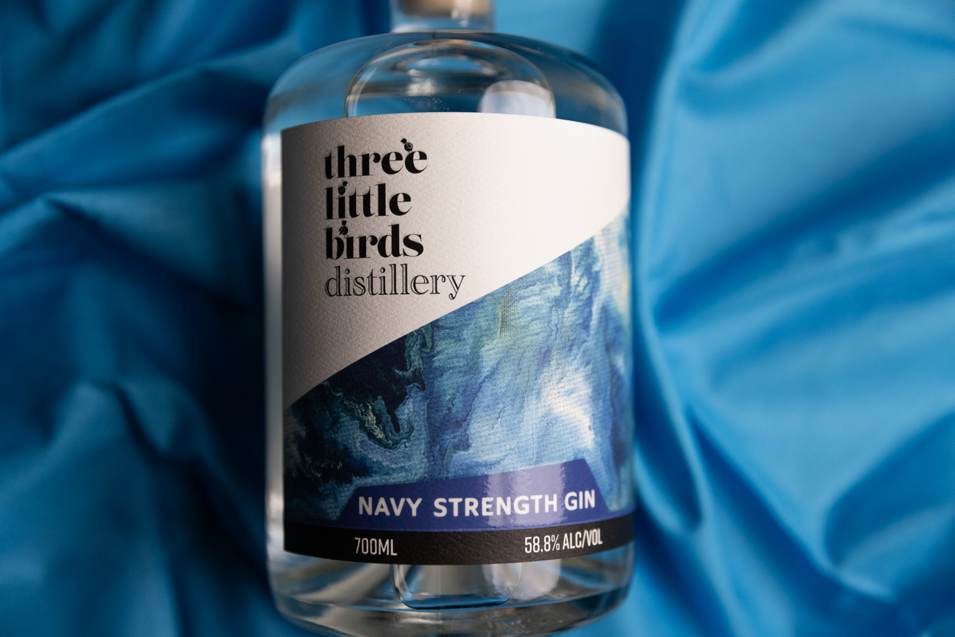 Three Little Birds Navy Strength Gin bottle with its blue label