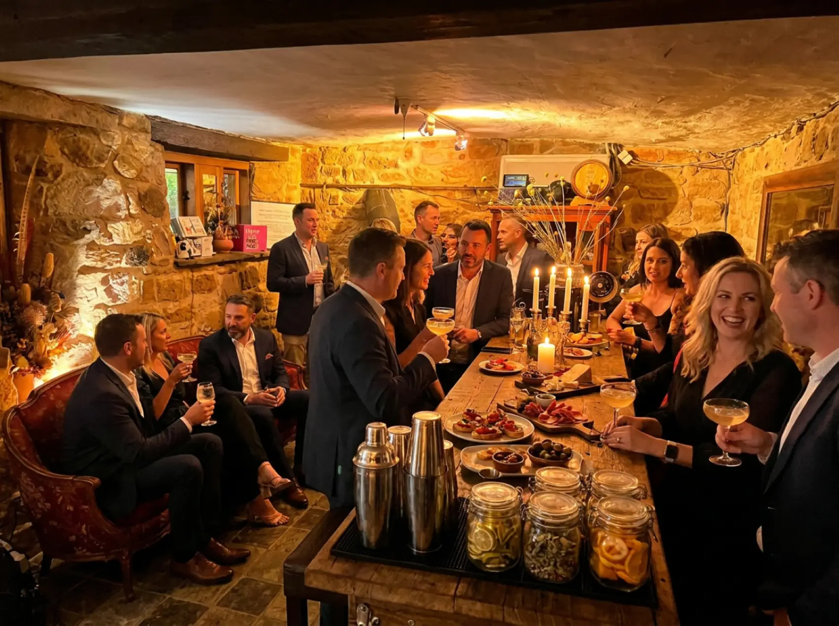 Guests toasting cocktails inside the candlelit stone tasting room at Sevenhill Social Club